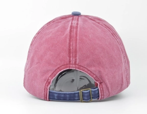 Detail of burgundy washed cotton baseball cap with adjustable copper buckle and navy strap