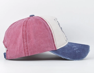 Detailed side view of vintage distressed tricolor baseball cap in red, white and blue