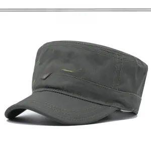 Detail of US NAVAL embroidery and army metal shield badge on camouflage military cap