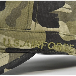 Detailed close-up of U.S. AIR FORCE embroidery on woodland camouflage cotton tactical cap