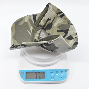 Detail showing the lightweight design of camouflage baseball cap weighing only 77.1 grams