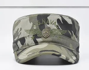 Detail of military camo flat top cap with U.S. Naval embroidery and metal army badge