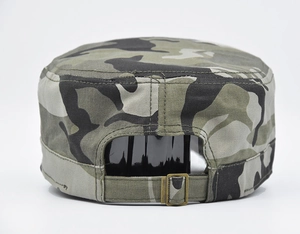 Detail view of the bronze metal adjustment buckle on camouflage cadet cap