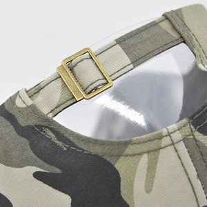 Detailed view of the camouflage baseball cap with adjustable antique bronze metal buckle