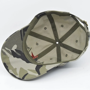 Internal view of camouflage baseball cap showing six-panel stitching and metal buckle strap