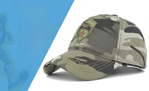 Detail of red embroidered star patch on camouflage cotton canvas baseball cap