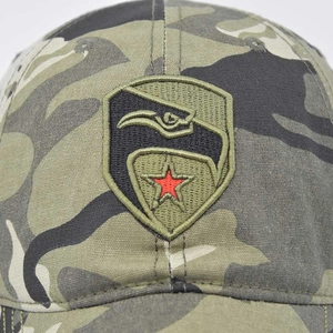Close-up of a camouflage baseball cap featuring a tactical eagle and red star embroidery