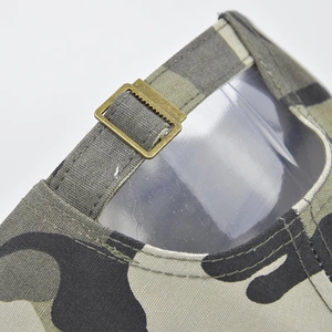 Rear view of camouflage baseball cap showing adjustable metal buckle and canvas strap