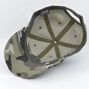 Detail view of cotton camo baseball cap interior showing sewing seams and metal buckle
