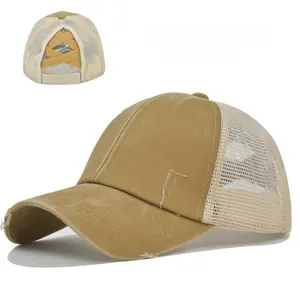 Detail view of khaki ponytail baseball cap with criss-cross elastic bands and mesh back