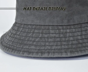 Detail view of washed canvas bucket hat showing stitching quality and fabric texture