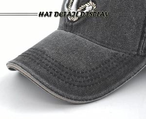 Detailed close-up of charcoal grey washed denim baseball cap with anchor embroidery