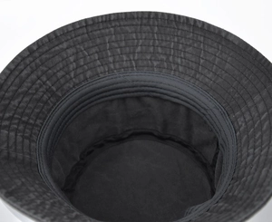 Detail view showing stitching craftsmanship and sweatband inside the washed canvas bucket hat