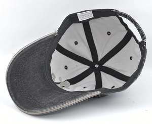 Detail of 100% cotton washed baseball cap interior with stitching and wash label
