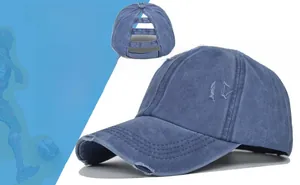 Detail of distressed washed denim ponytail baseball cap with triple back hole design
