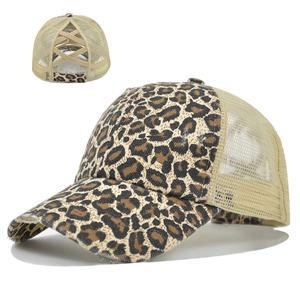 Close-up detail of leopard print trucker hat with elastic criss-cross ponytail opening