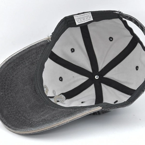 Internal view of a vintage washed denim baseball cap with cotton lining and adjustable strap