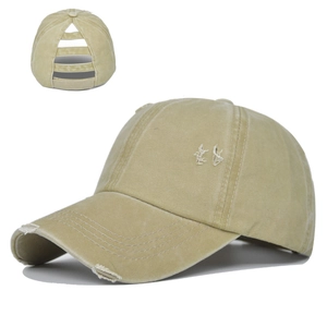 Detail of vintage washed ponytail baseball cap with distressed holes and multi-strap back