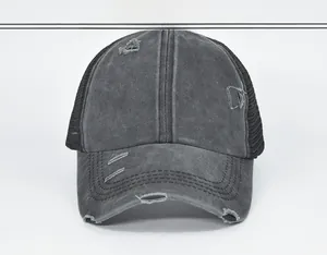 Front detail of distressed grey ponytail cap with vintage ripped brim and mesh back
