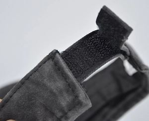 Close-up of adjustable velcro strap on a black denim sun visor hat for men and women