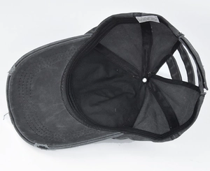 Internal view of a distressed cotton ponytail baseball cap with sweatband and wash label