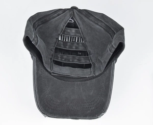 Detail of washed cotton ponytail baseball cap featuring cross elastic band back opening