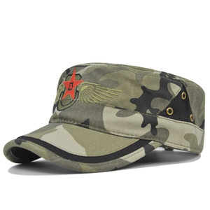 Close-up of camouflage military cap featuring red star embroidery and gold wings on side