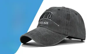 Detailed close-up of embroidered white New York Est 1625 logo on washed cotton baseball cap