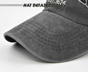 Detail of washed cotton baseball cap brim with multi-row stitching and white embroidery