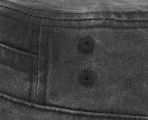 Detail view of washed cotton canvas fabric with stitched air vents and double-row sewing