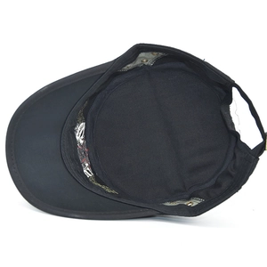 Detail view of black cadet cap interior with adjustable strap and metal eyelets