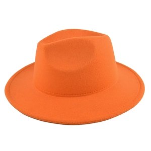 Detail of orange wool felt fedora with a flat brim and classic pinched crown design