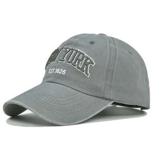 Detail view of New York embroidery and reinforced stitching on a grey washed cotton cap