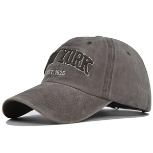 Close-up of the detailed New York EST.1625 embroidery on washed cotton baseball cap