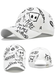 Detail view of white baseball cap with black graffiti prints and adjustable back strap