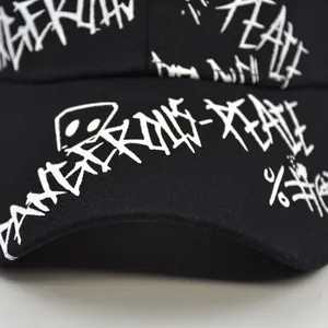 Graffiti printed black cotton baseball cap with white art lettering and monster patterns