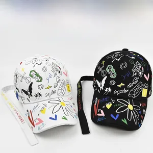 Detailed view of trendy graffiti print baseball caps with long decorative alphabet straps