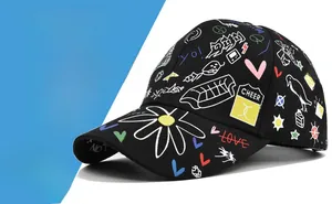 Detailed close-up of a black baseball cap featuring vibrant graffiti print and street style art