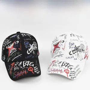 Detail view of black and white graffiti baseball caps with street style printed patterns