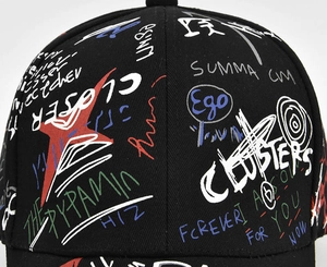 Close-up of black cotton baseball cap with vibrant street style graffiti print details