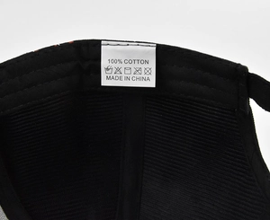 Detailed macro view of the 100% cotton label and inner stitching of the graffiti baseball cap
