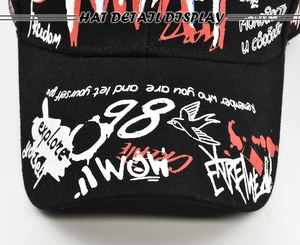 Fashionable black baseball cap with colorful graffiti print and outdoor sun protection