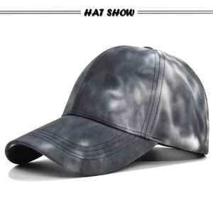 Close-up of grey tie-dye baseball cap fabric with reinforced stitching and ventilation