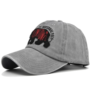 Close-up of vintage grey washed cotton baseball cap with black bear national park embroidery
