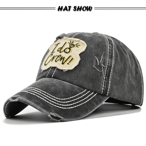 Detail of distressed grey denim baseball cap with I do Crew embroidery and gold diamond
