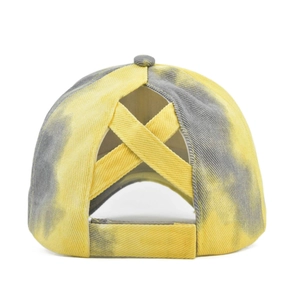 Detail of yellow and gray tie-dye baseball cap with elastic criss-cross ponytail holder