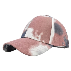 Close-up of tie-dye cotton twill baseball cap with vintage distressed texture
