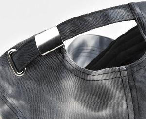 Macro detail of high-density washed cotton fabric and silver metal adjustable buckle