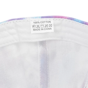 Detail shot of the cotton wash label and interior stitching on the tie-dye baseball cap
