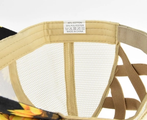 Detail showing high ponytail elastic criss-cross straps and breathable mesh on sunflower cap